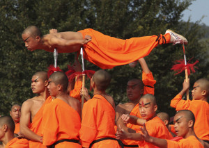 Shaolin monks perform qigong, a type of traditional Chinese martial arts, during the opening ceremony of the fourth Southern Shaolin Martial Arts Cultural Festival in Putian city